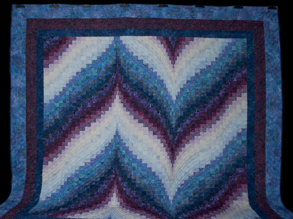Bargello Flame Batik style fabrics 
Queen size bed