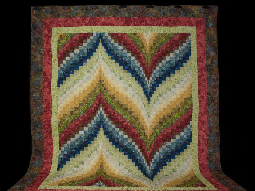 Bargello Flame Batik style fabrics 
Queen size bed