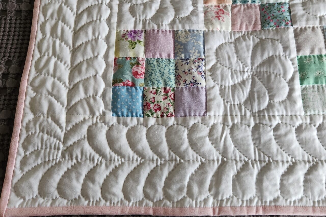 Pastel and White Nine Patch Crib Quilt (Pink Binding) - Image 4