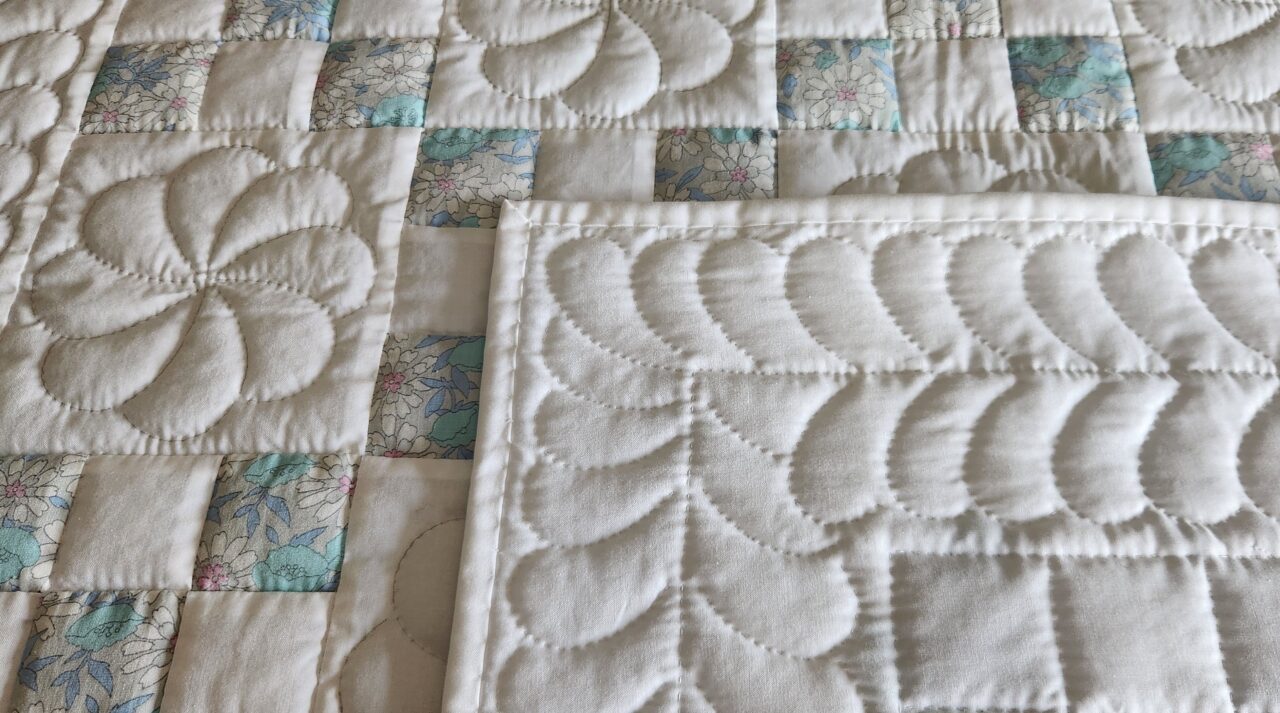 Vintage Floral and White Nine Patch Crib Quilt - Image 4