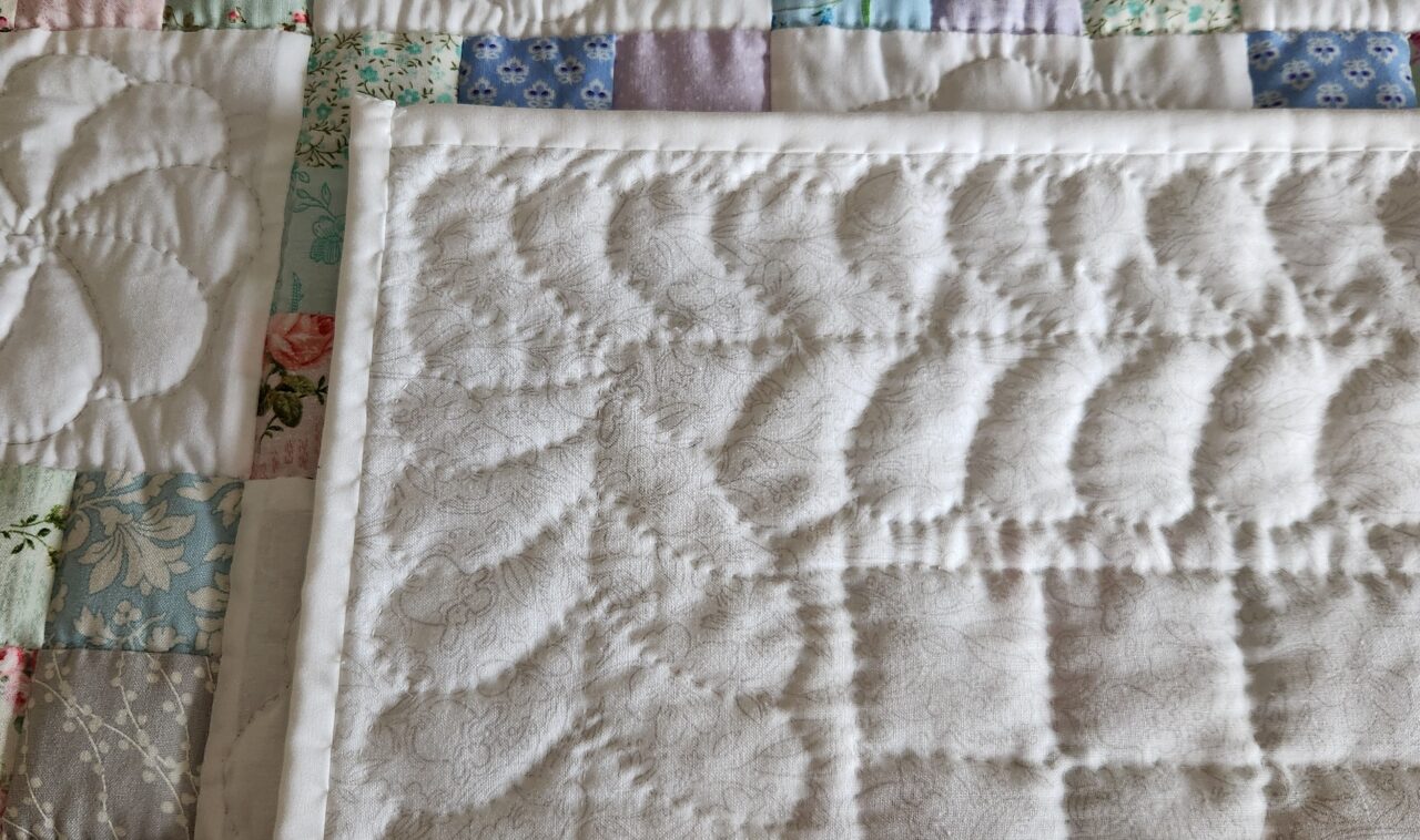 Pastel and White Nine Patch Crib Quilt (White Binding) - Image 4