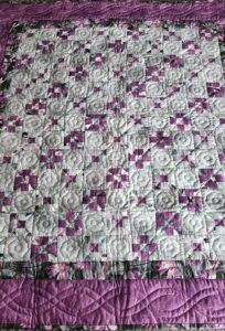 Pleasing Purple and Gray Nine Patch Quilt