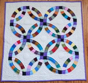 Indiana Amish Cream White Double Wedding Ring Wall Hanging (Purple Binding)