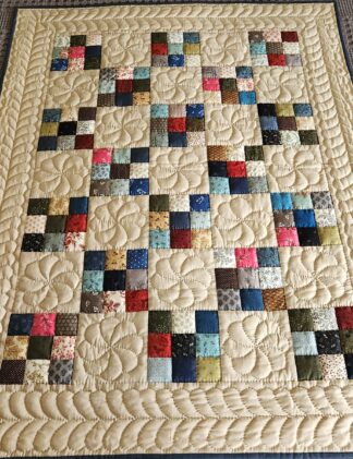 Tan and Multi-Color Nine Patch Quilt